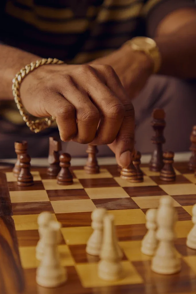 Closeup of Brandon making a chess move