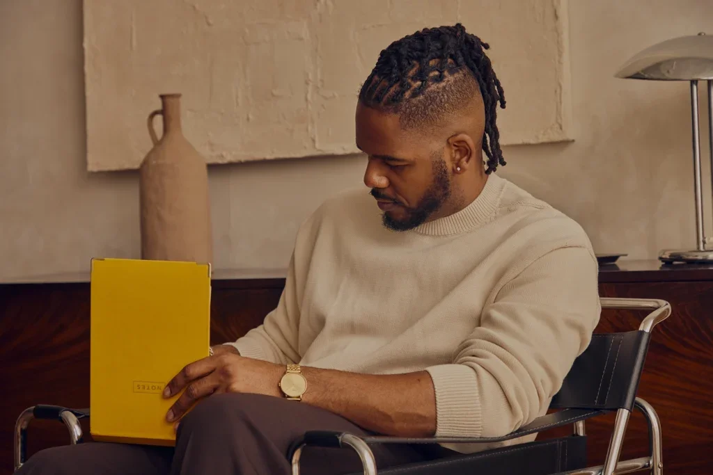 Brandon writing in a notebook